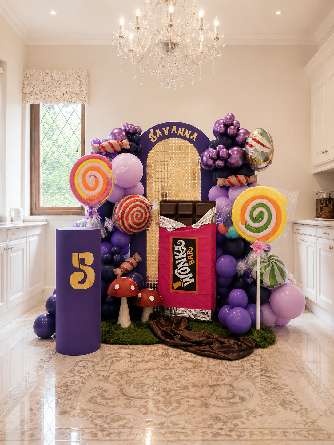 Oversized chocolate bar arch from Savanna's Willy Wonka fifth birthday styling with purple, brown and gold palette by River Fox Events